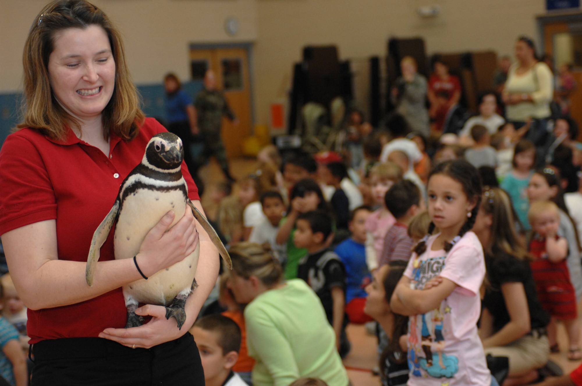 A SeaWorld Animal Ambassador Team member, walks around a South American Megalanic Penguin during a SeaWorld animal showcase at the Youth Center March 20, 2008 Nellis Air Force Base, Nev.
(U.S. Air Force Photo by/Senior Airman Larry E. Reid Jr.)