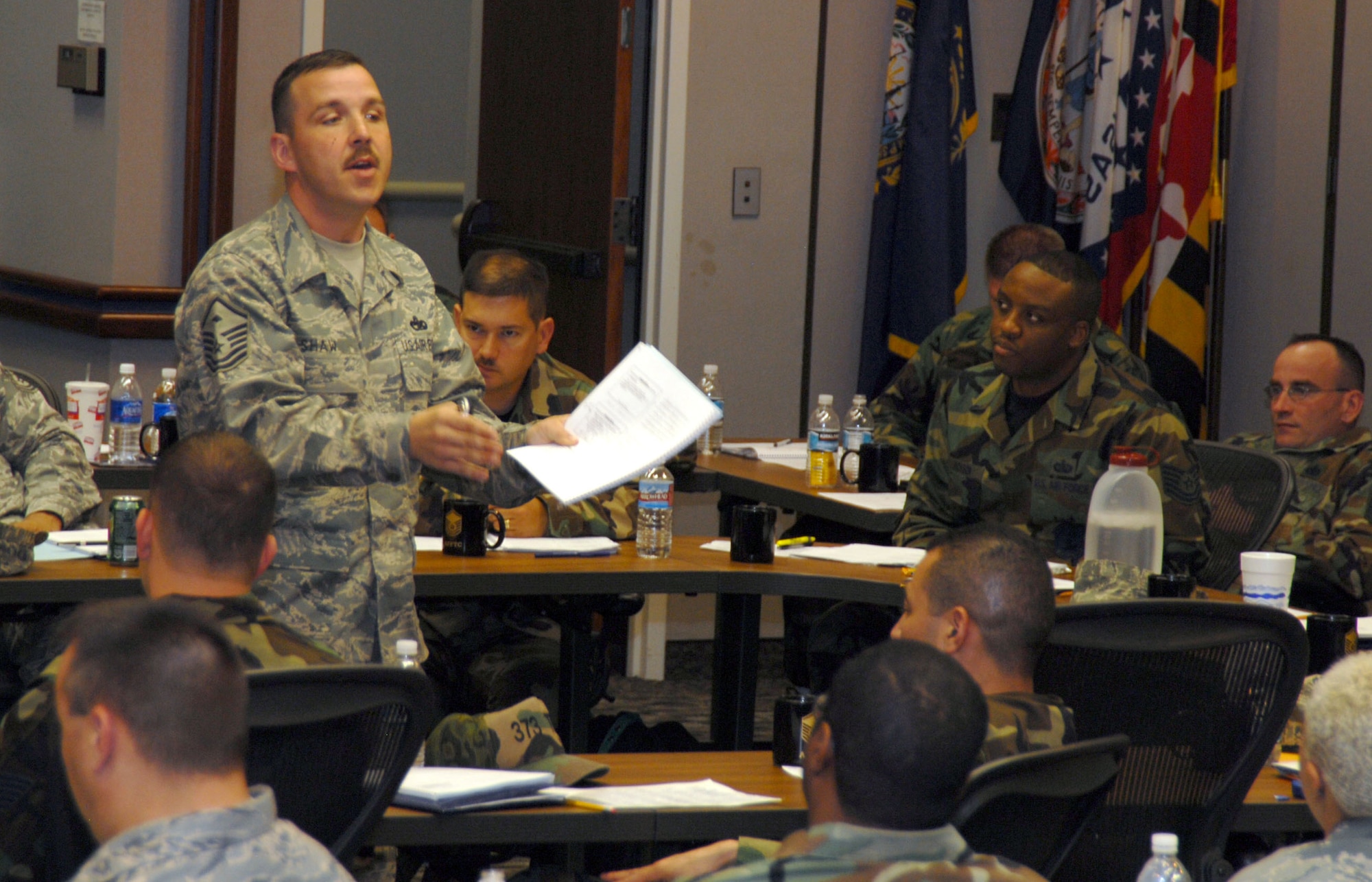 Master Sgt. Patrick Shaw, an instructor from the First Sergeant Academy located at Maxwell AFB, Ala., speaks to students attending a first sergeant symposium at the Conference Center here March 17 through 21. (Air Force photo by Senior Airman Julius Delos Reyes)