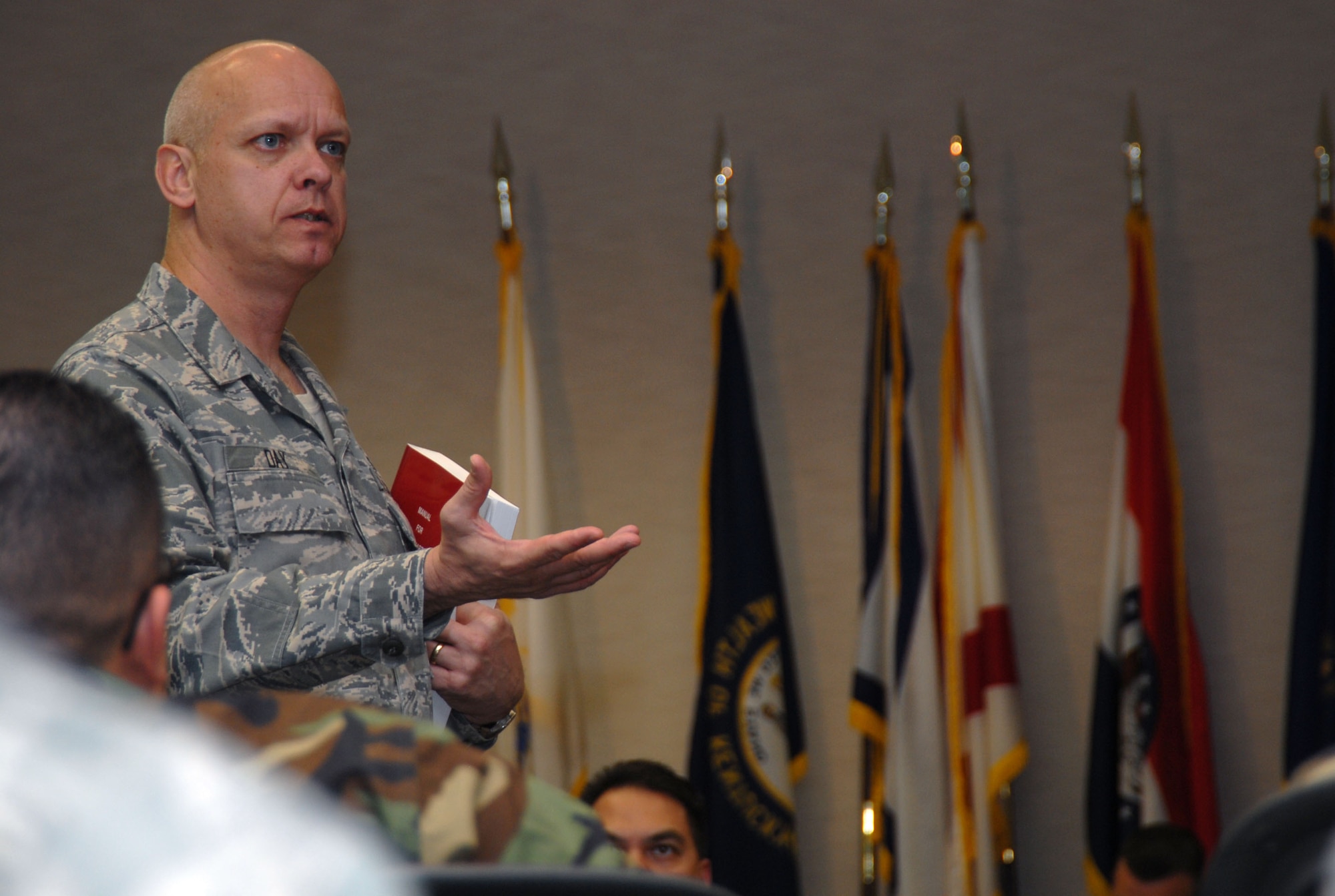Senior Master Sgt. Greg Day, an instructor from the First Sergeant Academy located at Maxwell AFB, Ala., speaks to students attending a first sergeant symposium at the Conference Center here March 17 through 21. Fifty-one students attended the symposium including technical sergeants, master sergeants and senior master sergeants. (Air Force photo by Senior Airman Julius Delos Reyes)
