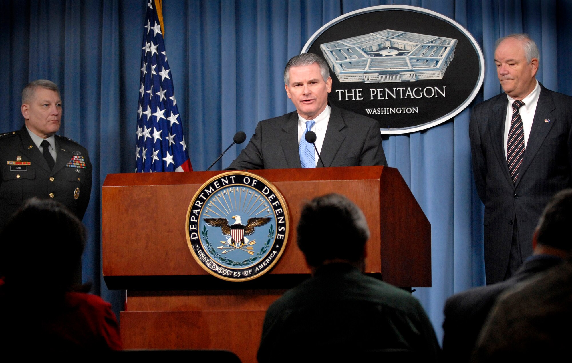 Principal Deputy Under Secretary Ryan Henry answers questions from reporters about nose cone assemblies for Minuteman missiles during a press briefing with Air Force Secretary Michael W. Wynne (right) and Director for Operations, Joint Staff, Lt. Gen. Carter Ham (left).  The non-nuclear assemblies were mistakenly shipped to Taiwan in 2006 and recently regained control by the U.S. Military.  (Department of Defense photo/U.S. Navy Petty Officer 2nd Class Molly A. Burgess)