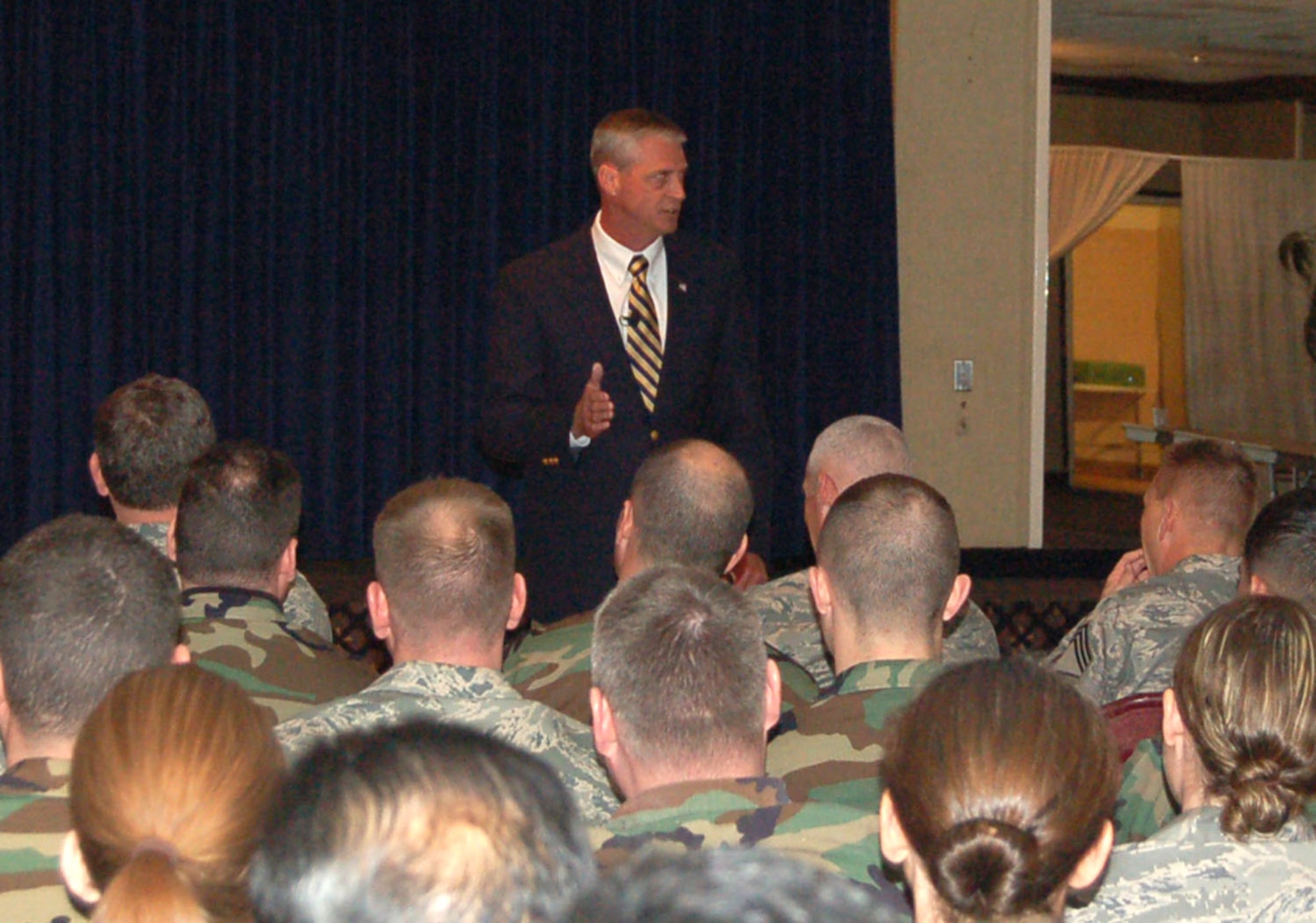 Retired Chief Master Sgt. Curtis Brownhill, a senior fellow at the Joint Forces Staff College, talks to enlisted personnel in the Peterson Club March 20. Chief Brownhill said the military’s various services will need to work together in order to effectively combat terrorism. (U.S. Air Force photo/Corey Dahl)