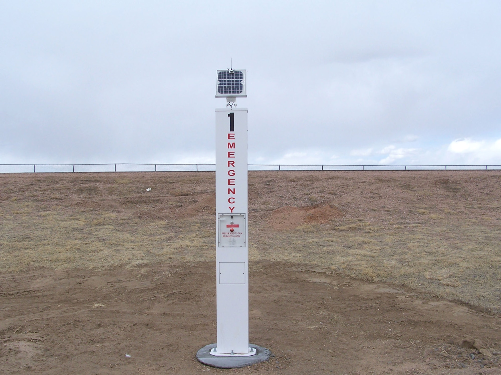 Three solar powered call boxes, like this one, have been set up around Peterson’s five and 10 kilometer trails. The call boxes use radio waves to transmit a call to the Peterson Installation Control Center. During an emergency, the caller simply pushes the bright red button on the box. They’re immediately connected with a dispatcher who can evaluate the level of the emergency and send help. (U.S. Air Force photo/Staff Sgt. Eric Palmer)