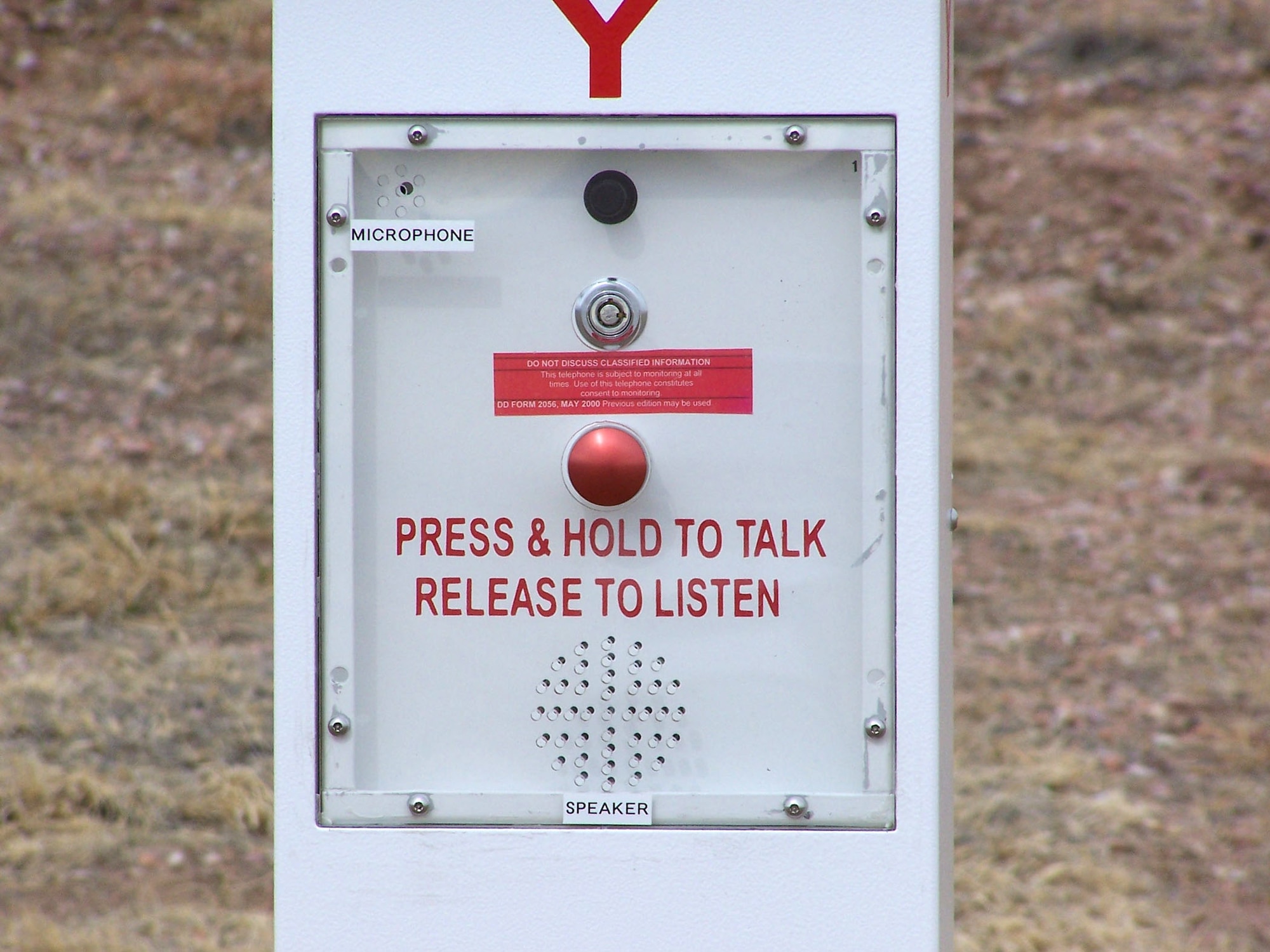 The solar powered call boxes are operated by pushing the red button to talk to a dispatcher and releasing the button to listen. The call boxes use radio waves to transmit a call to the Peterson Installation Control Center. During an emergency, the caller simply pushes the bright red button on the box. They’re immediately connected with a dispatcher who can evaluate the level of the emergency and send help. (U.S. Air Force photo/Staff Sgt. Eric Palmer)