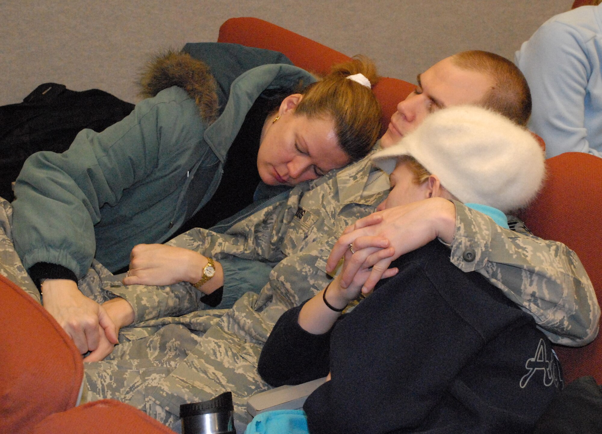 NIAGARA FALLS ARS, N.Y. -- A Citizen Airman spends a quiet moment with loved ones before departing for Afghanistan.  Nearly two dozen reservists of the 914th Civil Engineer Squadron departed Niagara for a deployment in support of Operation Enduring Freedom.  (U.S. Air Force photo / Airman Andrew Caya) 