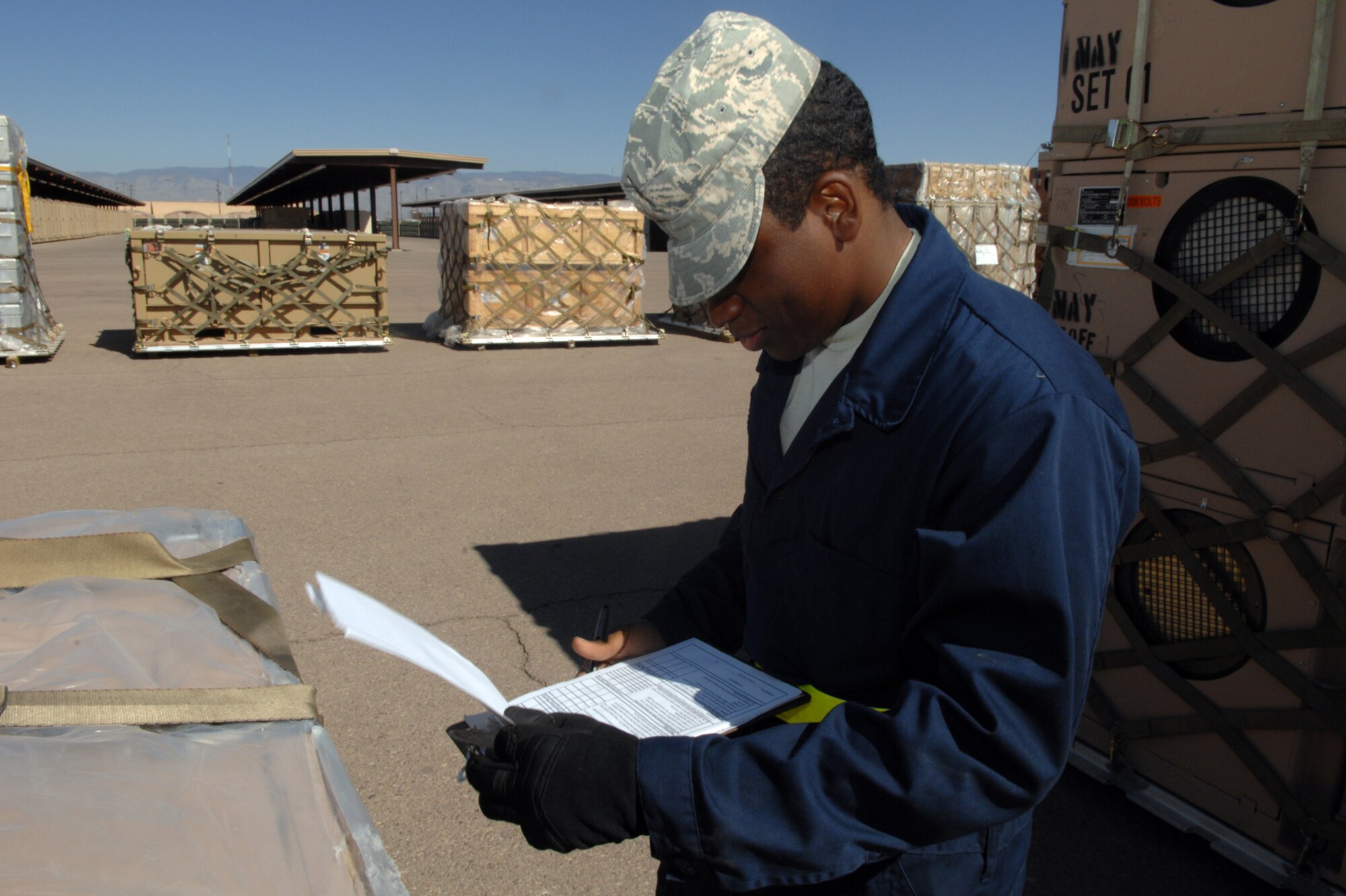 Airman 1st Class Cordero Cannon, 49th Materiel Maintenance Support Squadron, goes through a quality checklist on March 24 at Holloman Air Force Base, N.M. Airman Cordero is inspecting the unit to ensure it's deployment readiness. This unit, along with many others, is being deployed as part of a base-wide operational readiness exercise. (U.S. Air Force photo/Airman Sondra M. Wieseler)