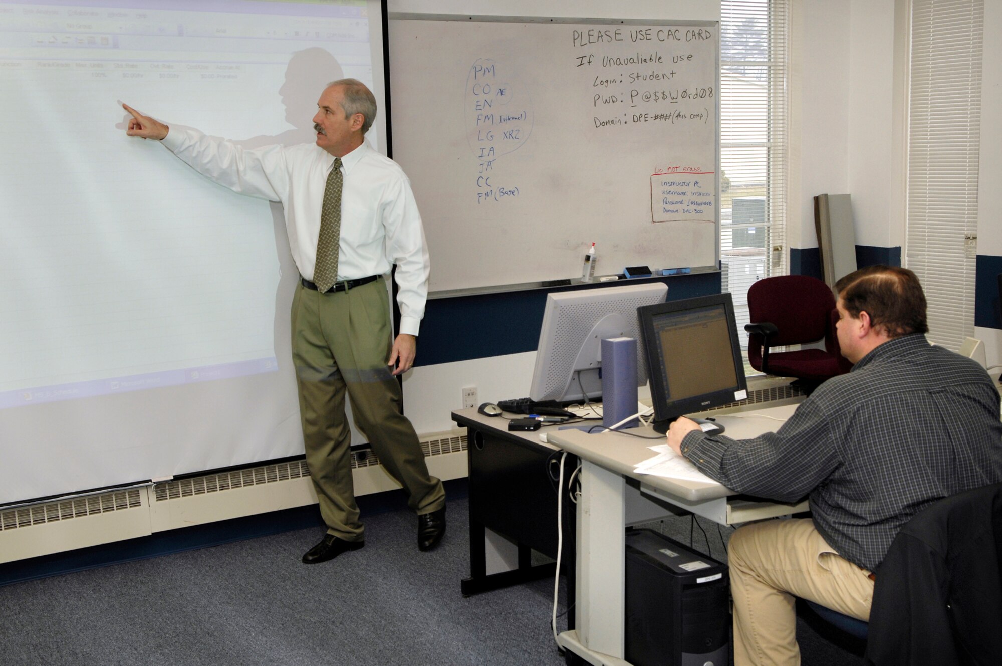 HANSCOM AFB, Mass. – Instructor Mike Mullen, from Brooks City-Base, Texas, guides a class here in developing a schedule using Microsoft Project during an Acquisition Schedule Management course offered as part of Integration Week March 12. More than 800 people attended one or more of the 60 classes offered during Integration Week March 11 through 14. The next Integration Week is scheduled for June 9 through 13. (U.S. Air Force photo by Mark Wyatt.)