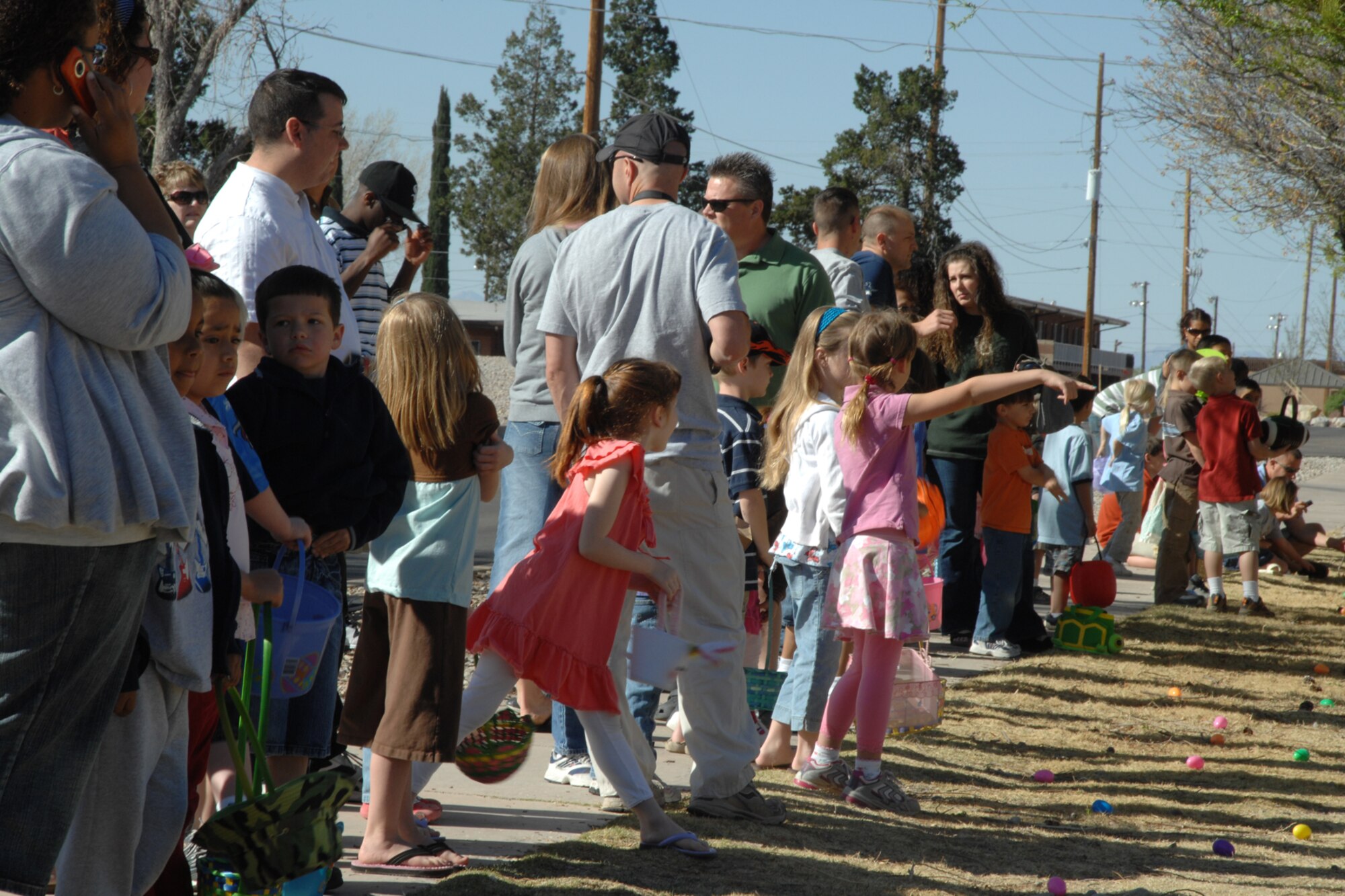 Parents and children await the official start of the Base Wide Easter Egg Hunt March 22 at Holloman Air Force Base, N.M. The event hosted more than 800 children and 1,500 parents and grandparents. Thirty-eight volunteers assisted with the event's set up. (U.S. Air Force photo/Airman 1st Class Jamal D. Sutter)