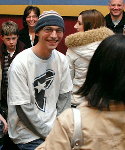 NIAGARA FALLS AIR RESERVE STATION, N.Y. -- Senior Airman Frank Coseglia, 914th Aeromedical Staging Squadron, shares a moment with friends from his unit following a charity fundraiser in his honor at the base theater Feb. 2. Airman Coseglia, a health services technician here since 2003, was diagnosed with leukemia Dec. 1, 2007.  (U.S. Air Force Photo / Staff Sgt. Dan Lanphear)