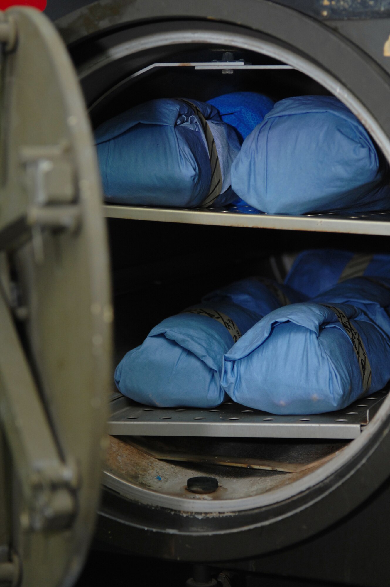 The medical tool sterilization process is conducted in two steps as tools are first placed in an ultrasonic bath and then are wrapped and placed in the sterilizer March 19 at Balad Air Base, Iraq. The 332nd Expeditionary Medical Group runs the Air Force Theater Hospital at Balad AB and provides a wide range of medical services to Airmen, Soldiers, Sailors and Marines throughout the Iraqi theater of operations. The hospital is the equivalent of a level one trauma center with more than 1,200 patients are seen by medical personnel each month, of which more than 650 are trauma cases. (U.S. Air Force photo/Senior Airman Julianne Showalter) 
