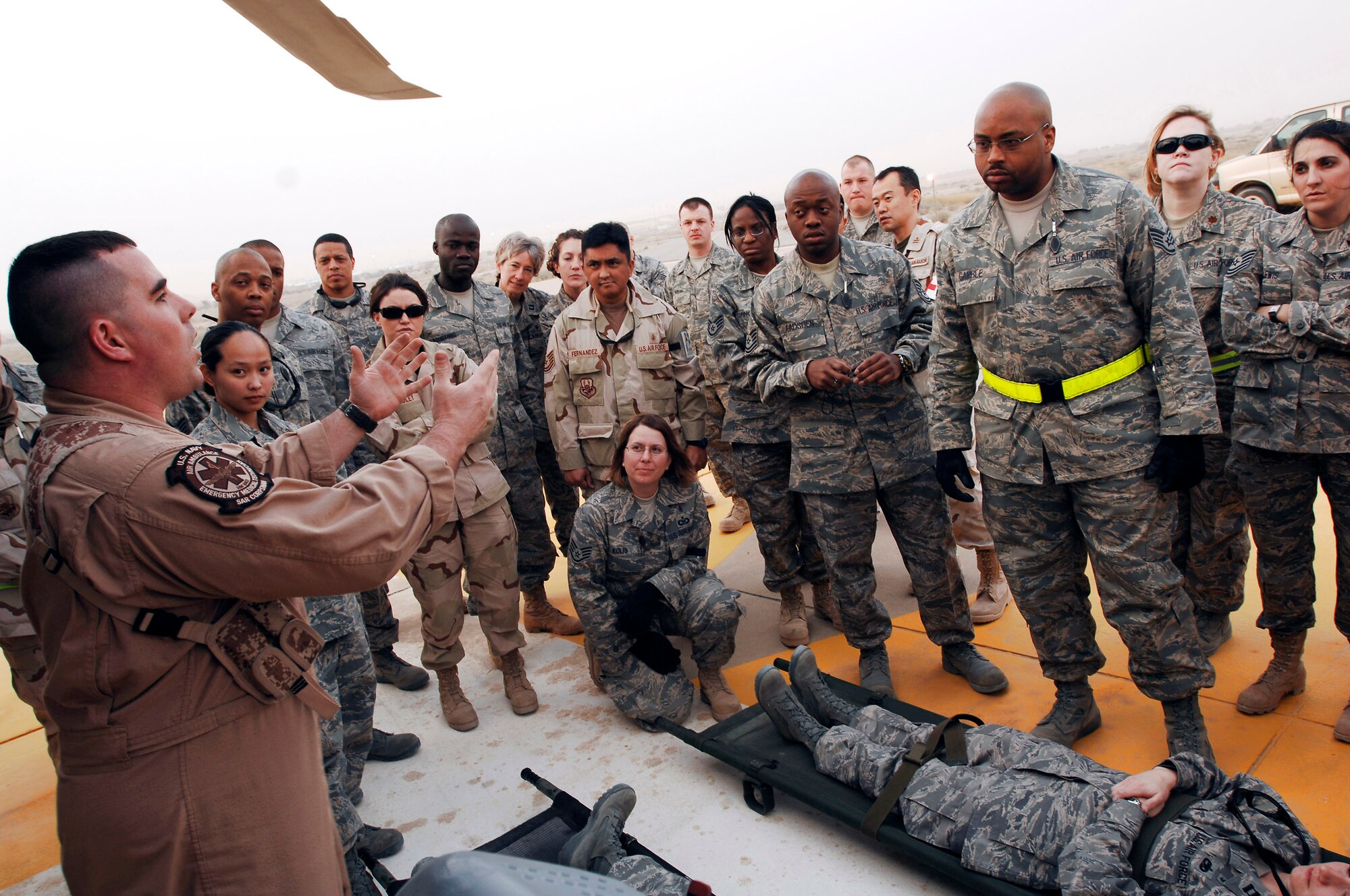Members from the 386th Expeditionary Medical Group, Navy and Japan Air Self-Defense Force came together for joint training Feb. 18 at a Southwest Asia air base. The joint training familiarizes medics on the loading and extracting techniques of patients for medical evacuation missions so members of each service can work together as a team in providing patients the best possible care. (U.S. Air Force photo/Staff Sgt. Patrick Dixon) 
