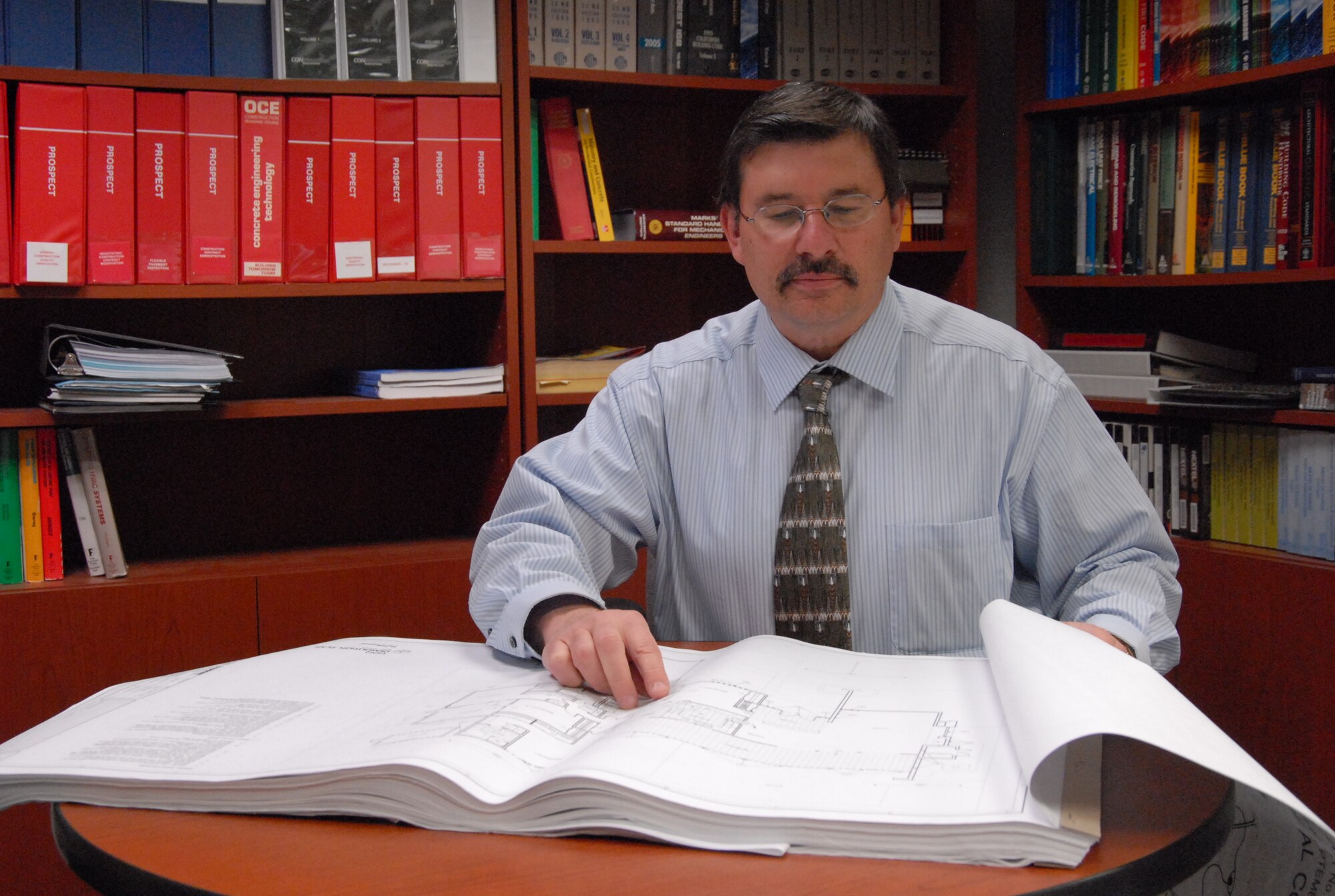 Joseph Hunt, 95th Civil Engineer and Transportation Directorate mechanical engineer, is the Air Force Flight Test Center Scientific and Engineering Civilian of the Year. Among his accomplishments during the year, Mr. Hunt resolved multiple construction issues for the military family housing project. He also spearheaded emergency repairs of the Airborne Laser hangar’s fire suppression and fire alarm system. (Air Force photo by Senior Airman Stacy Sanchez)