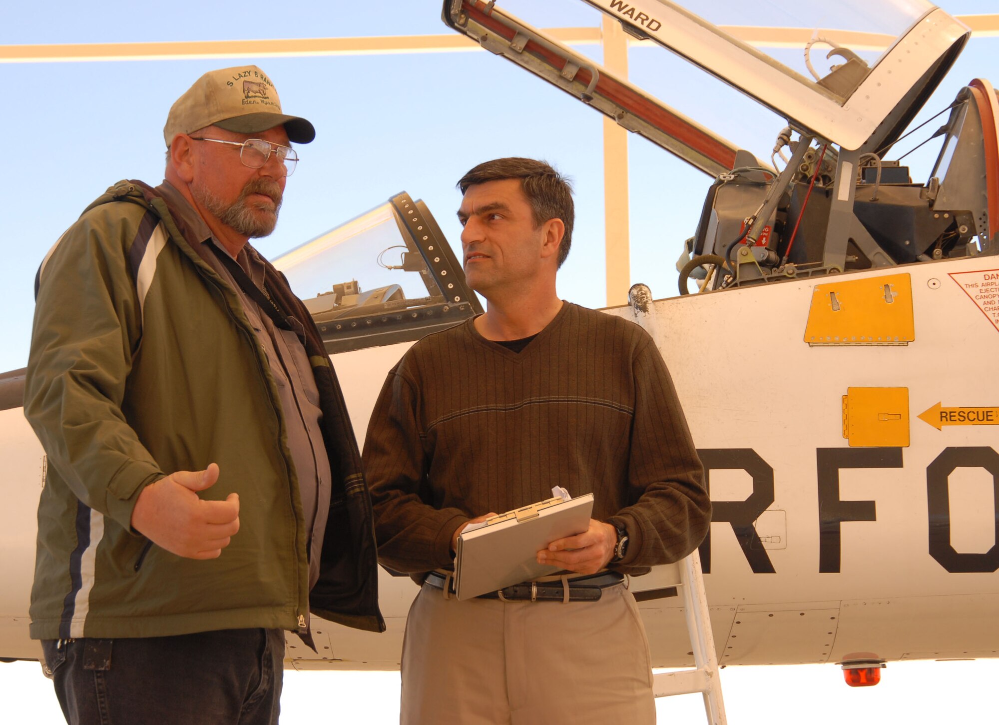 Bill Koukourikos (right), Air Force Flight Test Center Safety office safety and occupational health specialist, is the AFFTC Staff, Specialist and Analyst Civilian of the Year. Among his accomplishments during the year, Mr. Koukourikos managed the Safety office’s flight safety program for 11 squadrons, three detachments, the NASA Dryden Flight Research Center and the Aero Club. He ensured safe and effective flight test of Edwards' fleet, which includes 90 aircraft of more than 15 different airframes. (Air Force photo by Senior Airman Stacy Sanchez)