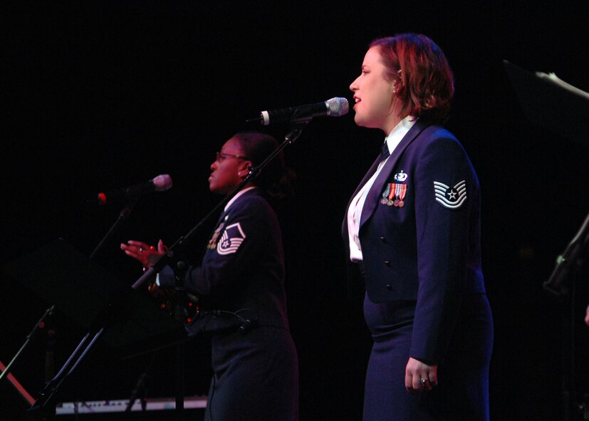 BOSSIER CITY, La. - Members of the 531st Air Force Band Texas Air National Guard "Band of the Gulf Coast" sing during the Holiday in Dixie Military Ball on Mar.16. (U.S. Air Force photo by Airman 1st Class Brittany Yevette Bateman)
