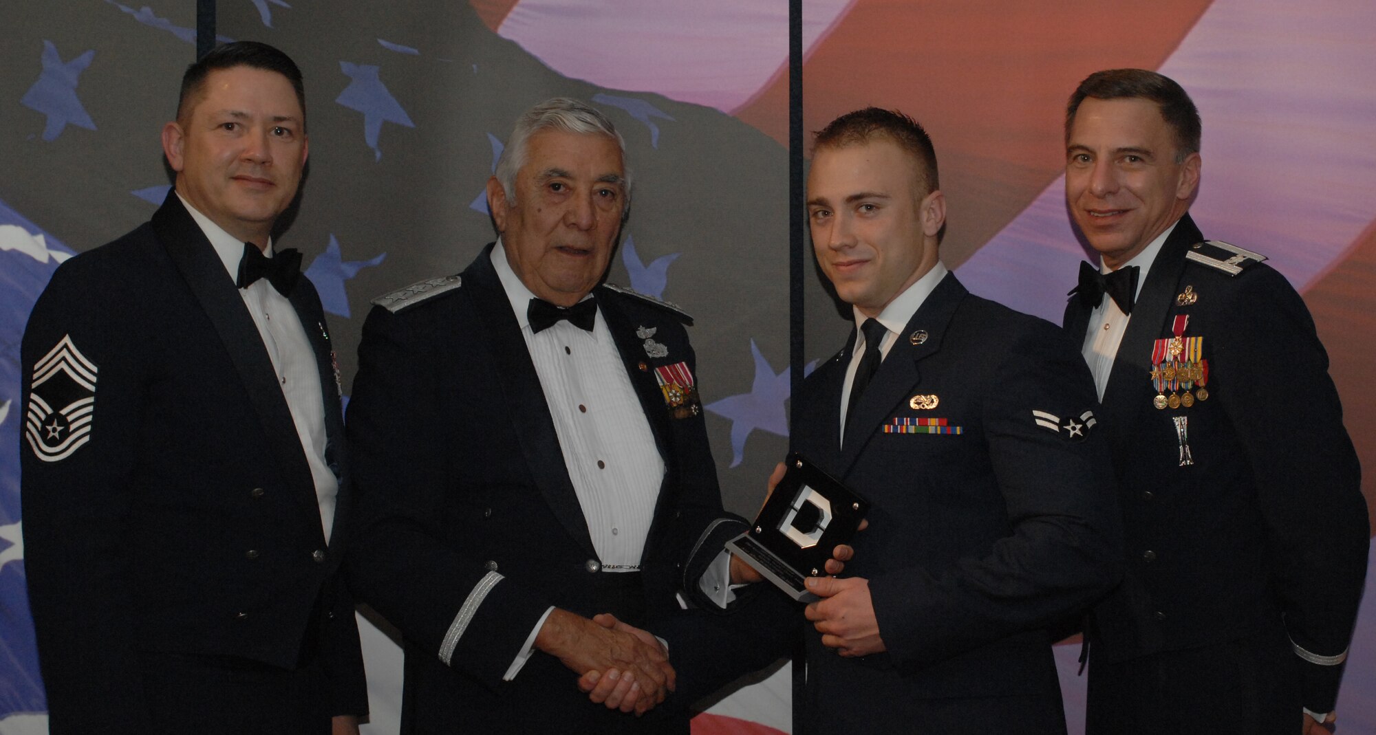 Knucklebuster People's Choice Award Airman Category
(from left) Chief Master Sgt. Gregory Blue, 100th Maintenance Group chief enlisted manager; Lt. Gen. Leo Marquez; Airman 1st Class Jeffrey McWhorter, 100th Aircraft Maintenance Squadron and award recipient; and Col. Michael Seville, 100th Maintenance Group commander. (U.S. Air Force photo by Airman 1st Class Brad Smith) 