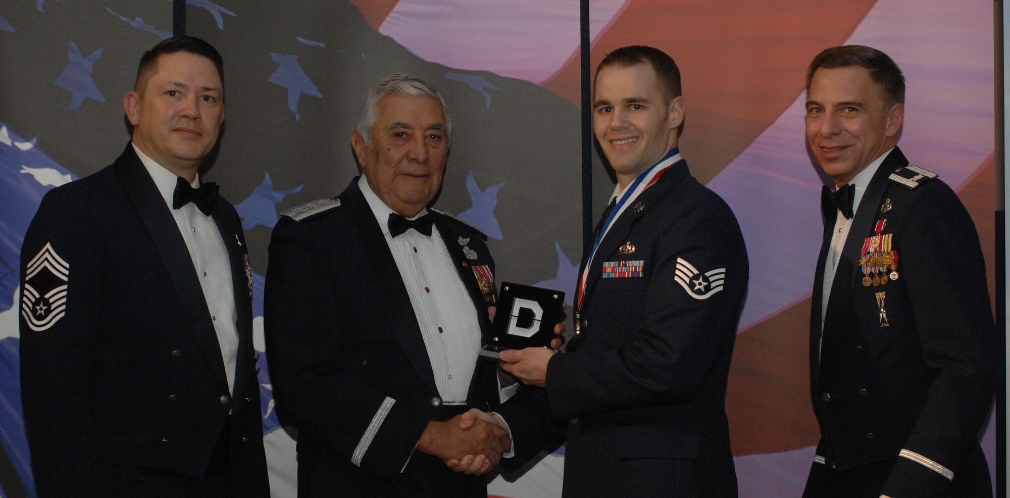 Knucklebuster People's Choice Award NCO Category
(from left) Chief Master Sgt. Gregory Blue, 100th Maintenance Group chief enlisted manager; Lt. Gen. Leo Marquez; Staff Sgt. Paul Goolsby 100th Maintenance Operations Squadron and award recipient; and Col. Michael Seville, 100th Maintenance Group commander. (U.S. Air Force photo by Airman 1st Class Brad Smith) 