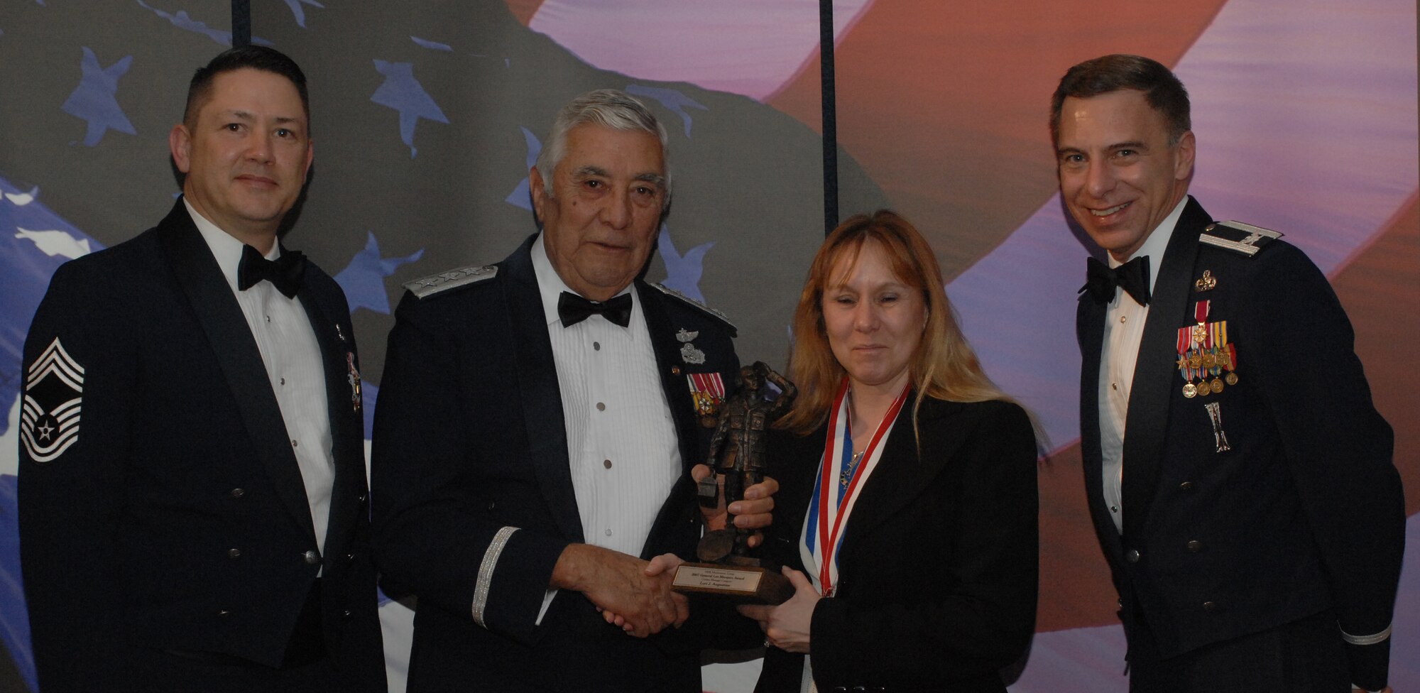 Lt. Gen. Leo Marquez Award Civilian Category
(from left) Chief Master Sgt. Gregory Blue, 100th Maintenance Group chief enlisted manager; Lt. Gen. Leo Marquez; Lori Augustine, 100th Maintenance Group and award recipient; and Col. Michael Seville, 100th Maintenance Group commander. (U.S. Air Force photo by Airman 1st Class Brad Smith) 