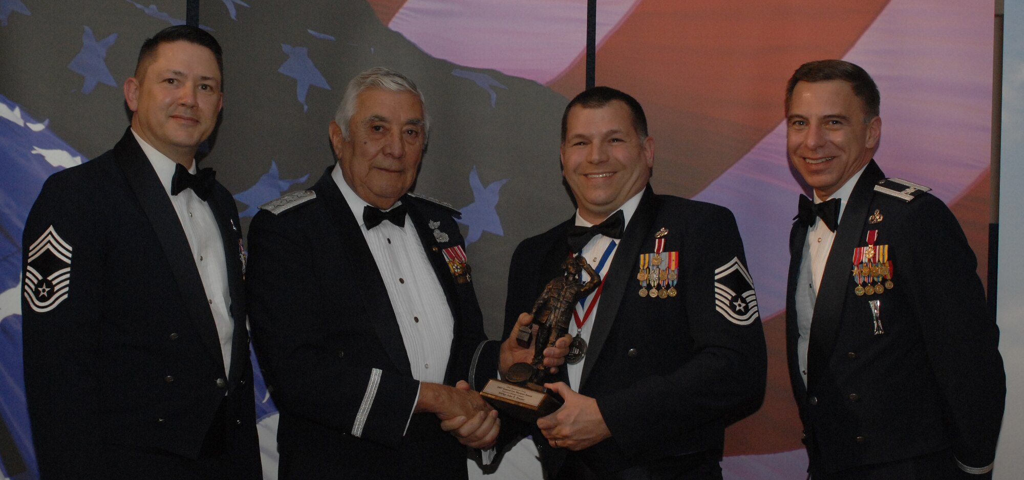 Lt. Gen. Leo Marquez Award Senior NCO Category
(from left) Chief Master Sgt. Gregory Blue, 100th Maintenance Group chief enlisted manager; Lt. Gen. Leo Marquez; Senior Master Sgt. John Frazier, 100th Aircraft Maintenance Squadron and award recipient; and Col. Michael Seville, 100th Maintenance Group commander. (U.S. Air Force photo by Airman 1st Class Brad Smith) 