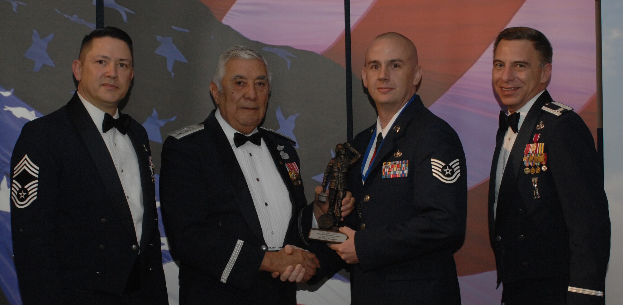 Lt. Gen. Leo Marquez Award NCO Category
(from left) Chief Master Sgt. Gregory Blue, 100th Maintenance Group chief enlisted manager; Lt. Gen. Leo Marquez; Tech. Sgt. Matthew Ghesquiere, 100th Aircraft Maintenance Squadron and award recipient; and Col. Michael Seville, 100th Maintenance Group commander. (U.S. Air Force photo by Airman 1st Class Brad Smith) 