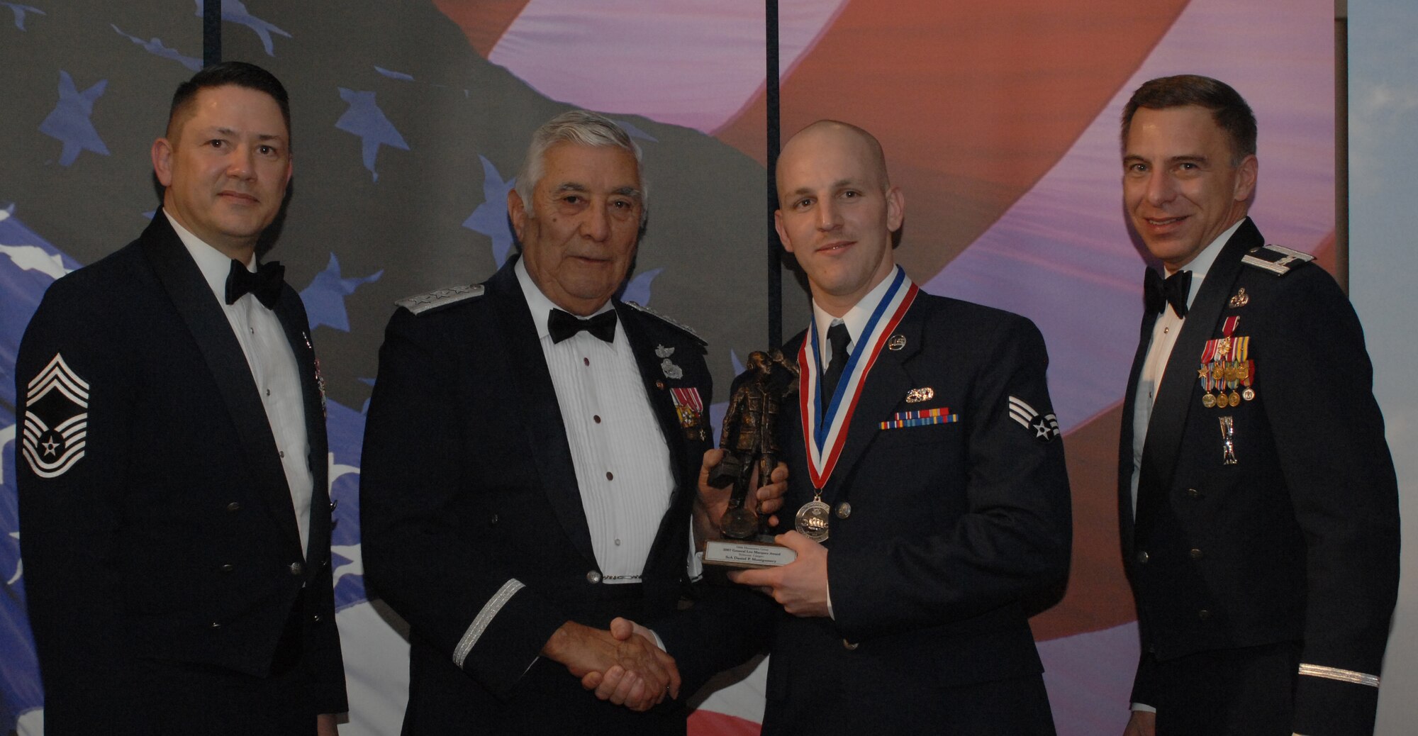 Lt. Gen. Leo Marquez Award Airman Category
(from left) Chief Master Sgt. Gregory Blue, 100th Maintenance Group chief enlisted manager; Lt. Gen. Leo Marquez; Senior Airman Daniel Montgomery, 100th Aircraft Maintenance Squadron and award recipient; and Col. Michael Seville, 100th Maintenance Group commander. (U.S. Air Force photo by Airman 1st Class Brad Smith) 