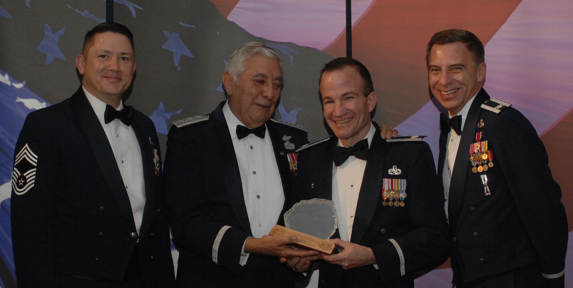 Lance P. Sijan Award Field Grade Officer Category 
(from left) Chief Master Sgt. Gregory Blue, 100th Maintenance Group chief enlisted manager; Lt. Gen. Leo Marquez; Lt. Col. Edward Kramer, 100th Maintenance Group and award recipient; and Col. Michael Seville, 100th Maintenance Group commander. (U.S. Air Force photo by Airman 1st Class Brad Smith) 
