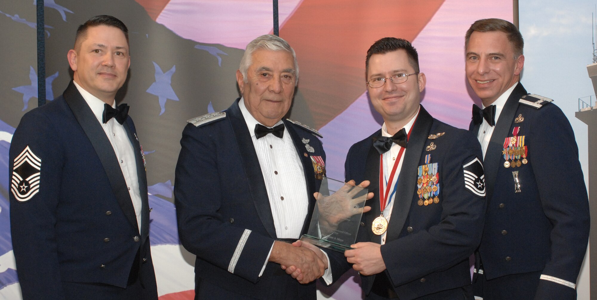 2007 Maintenance Group Annual Award Winner Senior NCO Category
(from left) Chief Master Sgt. Gregory Blue, 100th Maintenance Group chief enlisted manager; Lt. Gen. Leo Marquez; Master Sgt. James Mays, 100th Aircraft Maintenance Squadron and award recipient; and Col. Michael Seville, 100th Maintenance Group commander. (U.S. Air Force photo by Airman 1st Class Brad Smith)