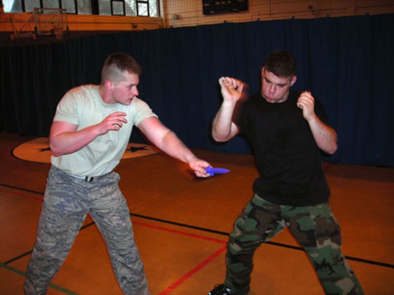 Airmen 1st Class Jennifer Picard and Julianne Artino practice a Krav Maga move learned during recent training at RAF Mildenhall. Krav Maga is the official self-defense system of the Isreali Defense Forces. The Airmen are assigned to the 423rd Security Forces Squadron at RAF Alconbury and are two of 12 Airmen on Alconbury to receive the training.   