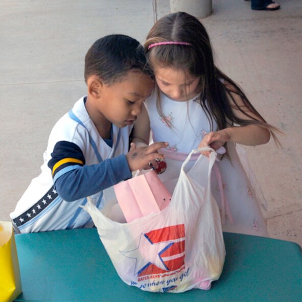 DYESS AIR FORCE BASE, Texas -- Amber Spears age 5 and Julius Smith age 4 count and compare how many eggs they found after their treasure hunt at the Child and Development Center (CDC), Mar. 21.  This is the first event to kick off the Month of the Military Child in April which is sponsored by the CDC.  The CDC will put on a parade and barbecue in April for more than 200 children whom they provide care for. (U.S. Air Force Photo by Staff Sergeant Connor W. Estes)
