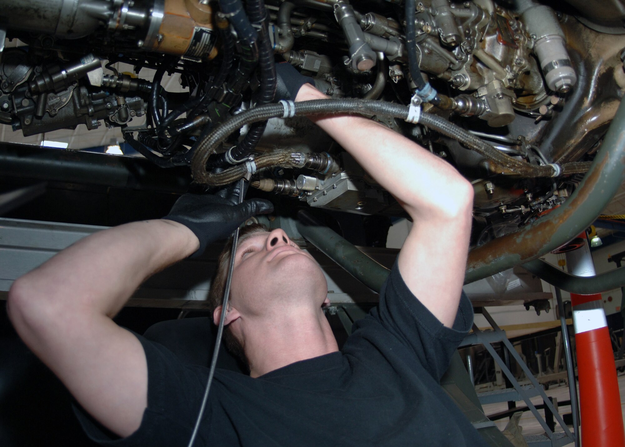 DYESS AIR FORCE BASE, Texas -- Senior Airman Jack Ruen runs a borescope into the engine turbines, Mar. 24. The borescope monitors the turbines for small cracks and potential damage that may cause engine failure. (U.S. Air Force Photo by Airman 1st Class Micheal Breaux)