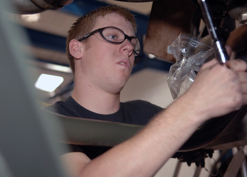 DYESS AIR FORCE BASE, Texas -- Airman 1st Class A.J. Carden turns a PTO wrench to spin the turbines and allow the borescope to view the engine, Mar. 24. The PTO wrench determines the speed of the turbines and allows the user of the borescope to properly inspect the engine. (U.S. Air Force Photo by Airman 1st Class Micheal Breaux)