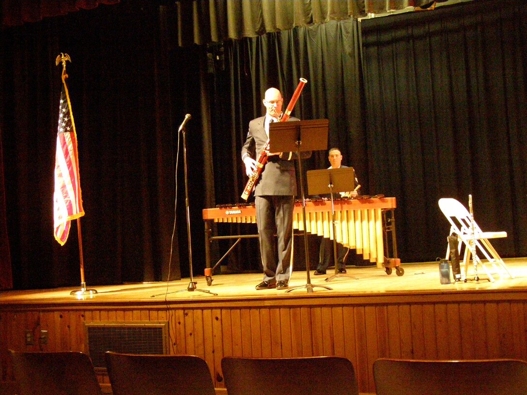 Senior Airman Jonathan Biccum from the USAF Heartland of America Band performs a bassoon solo during a local Winds of Freedom performance.  This concert at Nebraska City High School was part of the group's seven day local February tour.