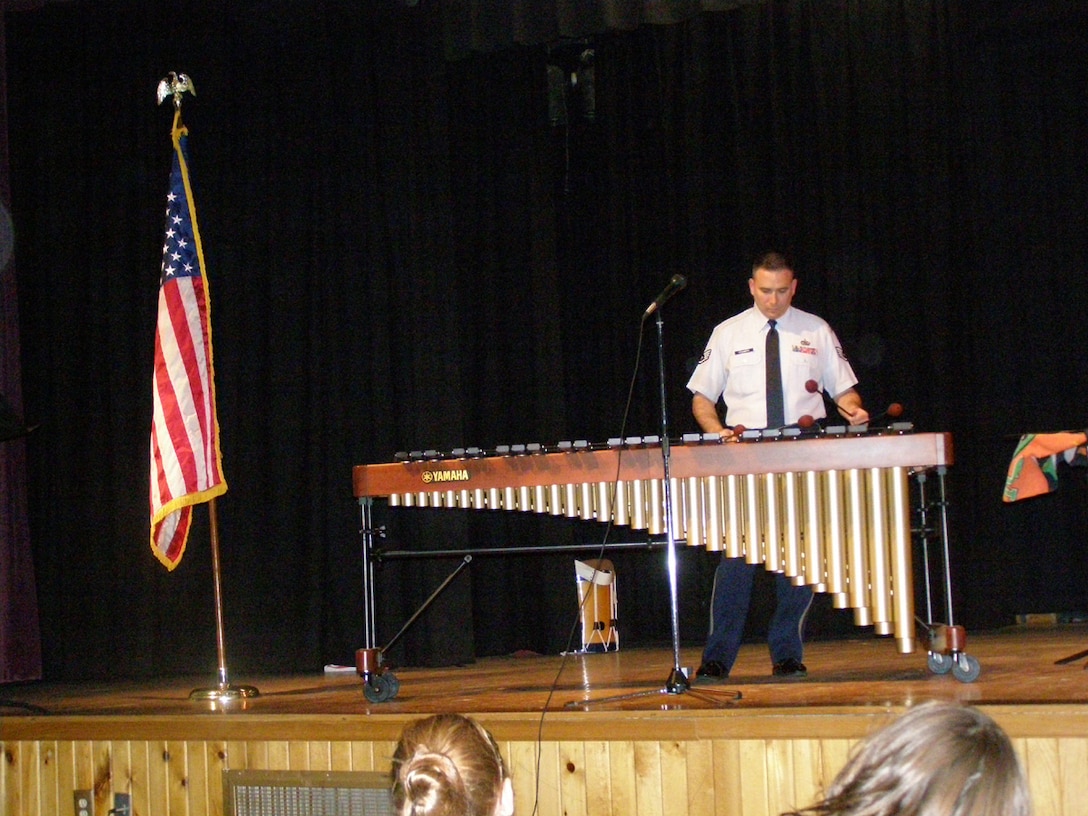 Staff Sgt. Gary Steinberg, percussionist with the Winds of Freedom, performs a Marimba solo during a concert in Nebraska City.  This performance was part of the group's February local tour.