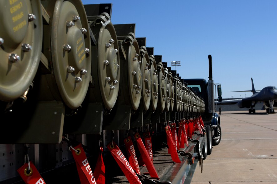DYESS AIR FORCE BASE, Texas -- Bombs await transport back to storage after being unloaded from a B-1 Lancer, March 19. A B-1 Lancer is able to carry up to 75,000 pounds of bombs. (U.S. Air Force photo by Senior Airman Courtney Richardson)