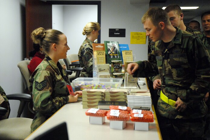 Staff Sgt. Erin Brock speaks with 1st Lt. Joshua Brock while going through the mobility processing line during the Mobility Exercise Crisis Look 08-03 March 20 at the 437th Logistics Readiness Squadron Personnel Deployment Facility.  Airmen walk through the line to speak with various agencies from across Charleston AFB to get last-minute information and goodies before deploying.  Sergeant Brock is a chaplain assistant with the 437th Airlift Wing base chapel and Lieutenant Brock is an acquisition officer with the 437th Contracting Squadron.