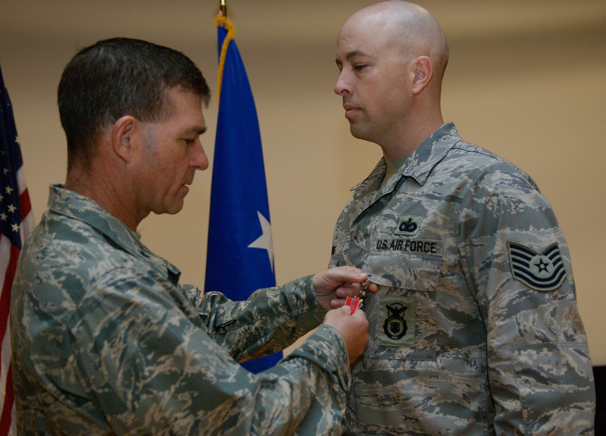 LANGLEY AIR FORCE BASE, Va. – Brig. Gen. Mark Barrett, 1st Fighter Wing commander, presents Tech. Sgt. Douglas Rose, 1st Security Forces Squadron, with the bronze star medal, first oak leaf cluster, March 25 for his accomplishments while serving with the Joint Task Force in support of Operation Iraqi Freedom from December 2006 to October 2007. Since 2005, the 1st Security Forces Squadron has had six Bronze Stars awarded to members of its unit for dedicated service in Operation Iraqi Freedom. (U.S. Air Force photo/Staff Sgt. Samuel Rogers)