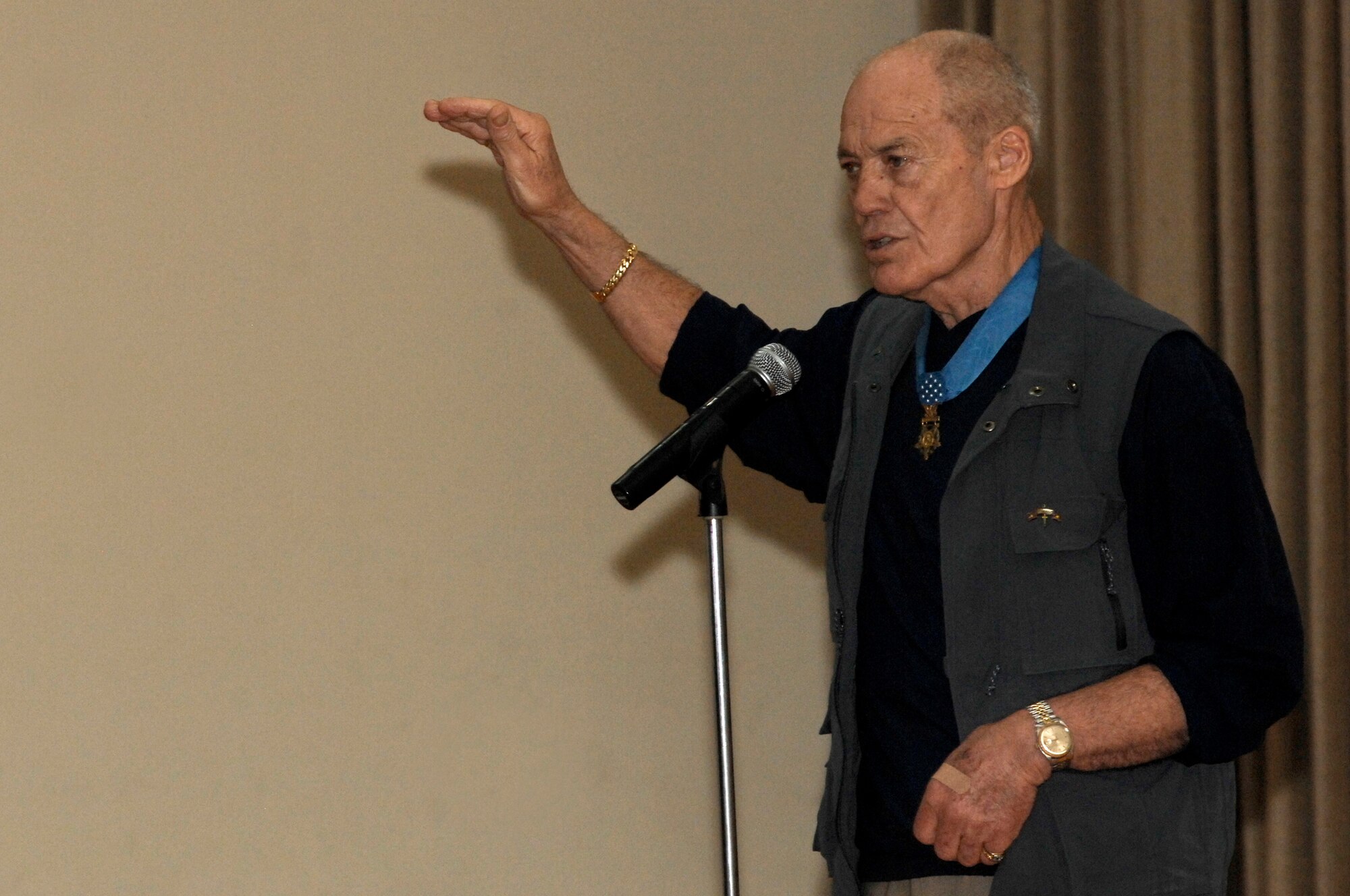 SOUTHWEST ASIA -- Congressional Medal of Honor recipient Army (retired) Col.  Robert Howard speaks to Airmen, Soldiers and Marines at the 386th Air Expeditionary Wing theater March 23, 2008, at an air base in the Persian Gulf Region. Three Congressional Medal of Honor recipients, Colonel Robert Howard, Marine Corps (retired) Capt. John McGinty III, and Army (retired) Sgt. Maj. Gary Littrell, are touring throughout the area of responsibility to share their experiences with service members deployed in support of Operations Enduring and Iraqi Freedom. Today, only 105 recipients are still alive.  (U.S. Air Force photo/ Staff Sgt. Patrick Dixon)