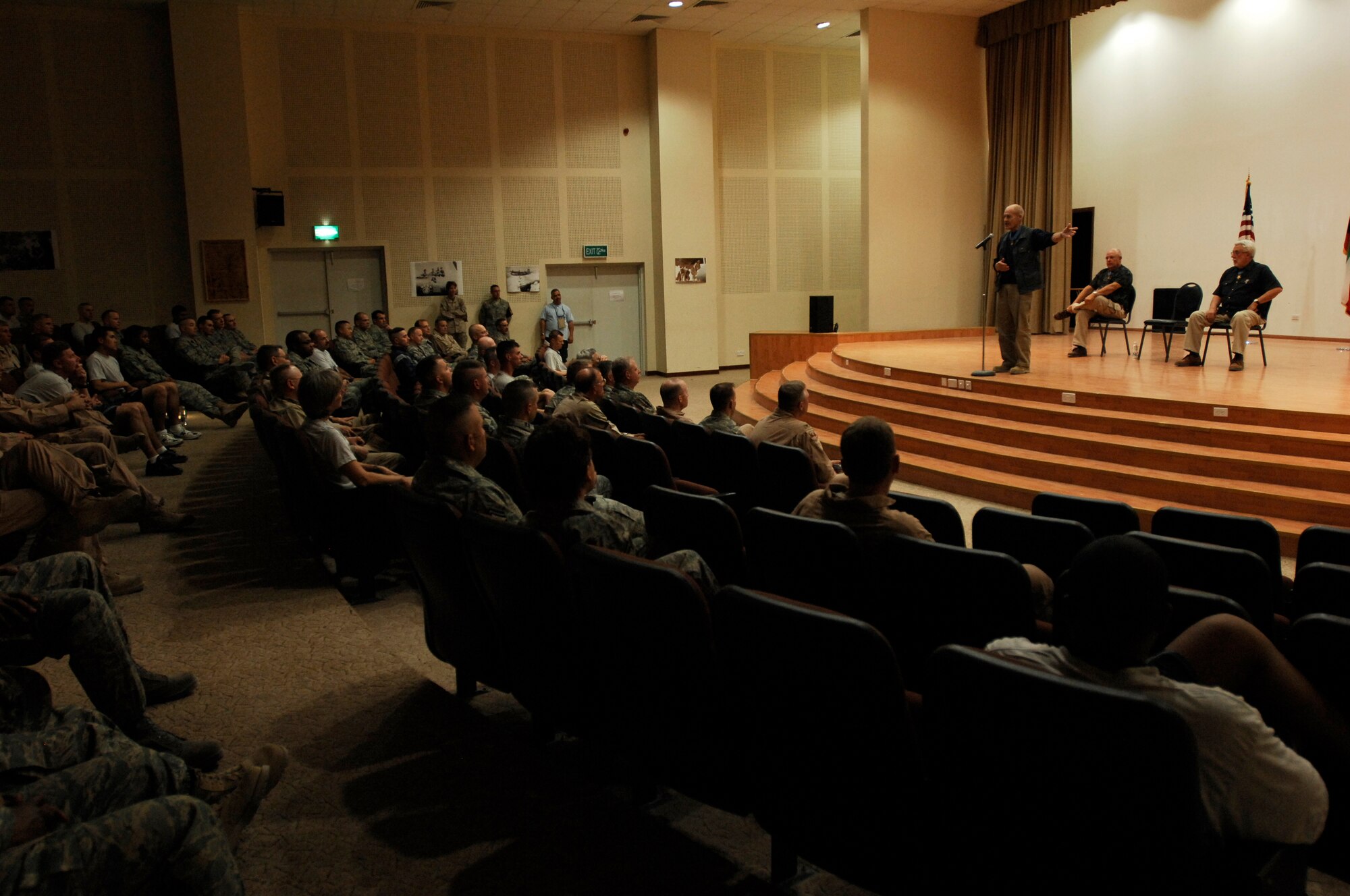 SOUTHWEST ASIA -- Congressional Medal of Honor recipient Army (retired) Col. Robert Howard speaks to Airmen, Soldiers and Marines at the 386th Air Expeditionary Wing theater March 23, 2008, at an air base in the Persian Gulf Region. Colonel Robert Howard and his fellow recipients, Marine Corps (retired) Capt. John McGinty III, and Army (retired) Sgt. Maj. Gary Littrell, are touring throughout the area of responsibility to share their experiences with service members deployed in support of Operations Enduring and Iraqi Freedom. Today, only 105 recipients are still alive. (U.S. Air Force photo/ Staff Sgt. Patrick Dixon)