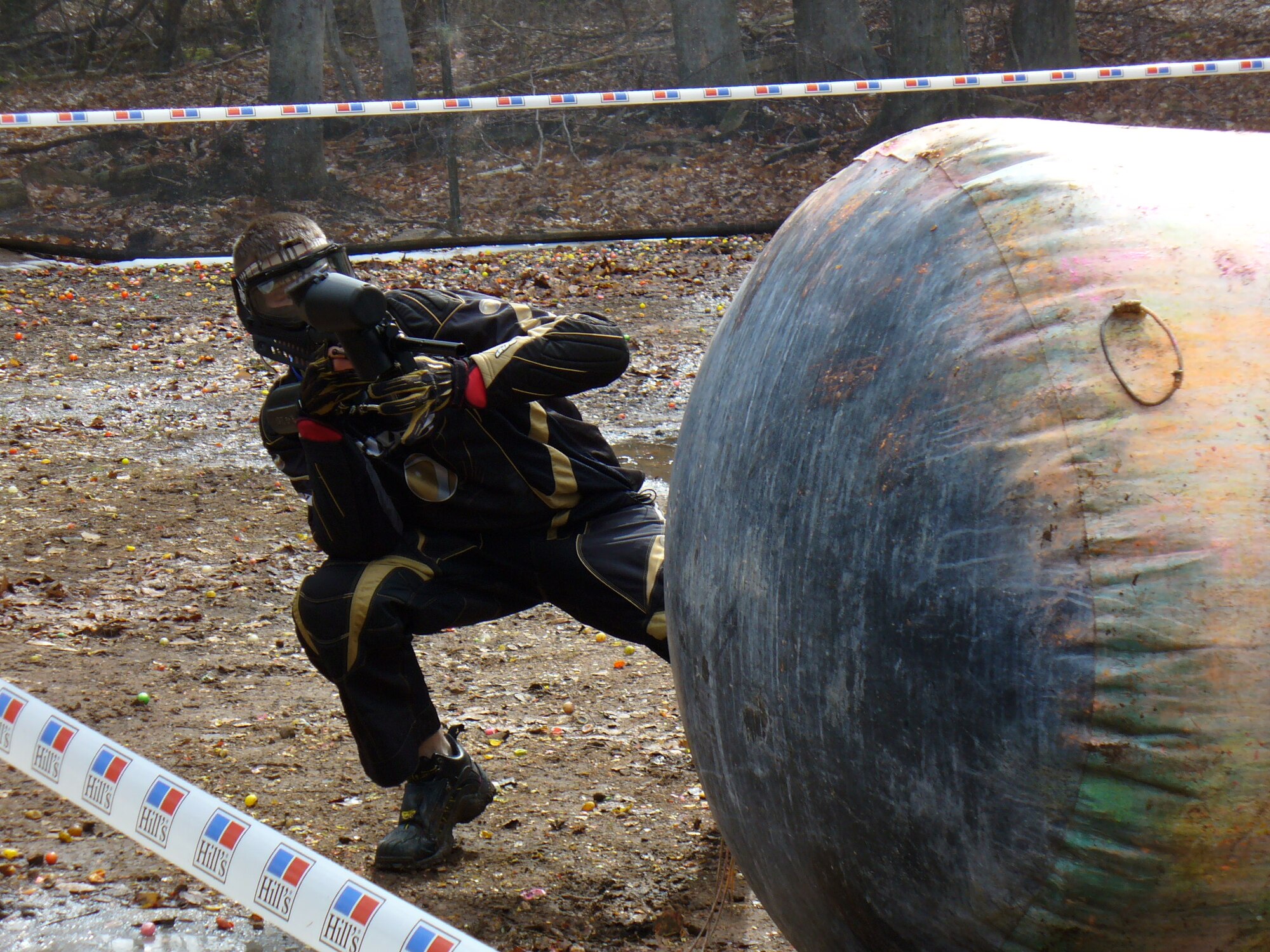 Airman First Class Joshua Harm from the Landstuhl Regional Medical Center aims his marker at an opponent during the USAFE Services Project CHEER Paintball Championship Mar 22.