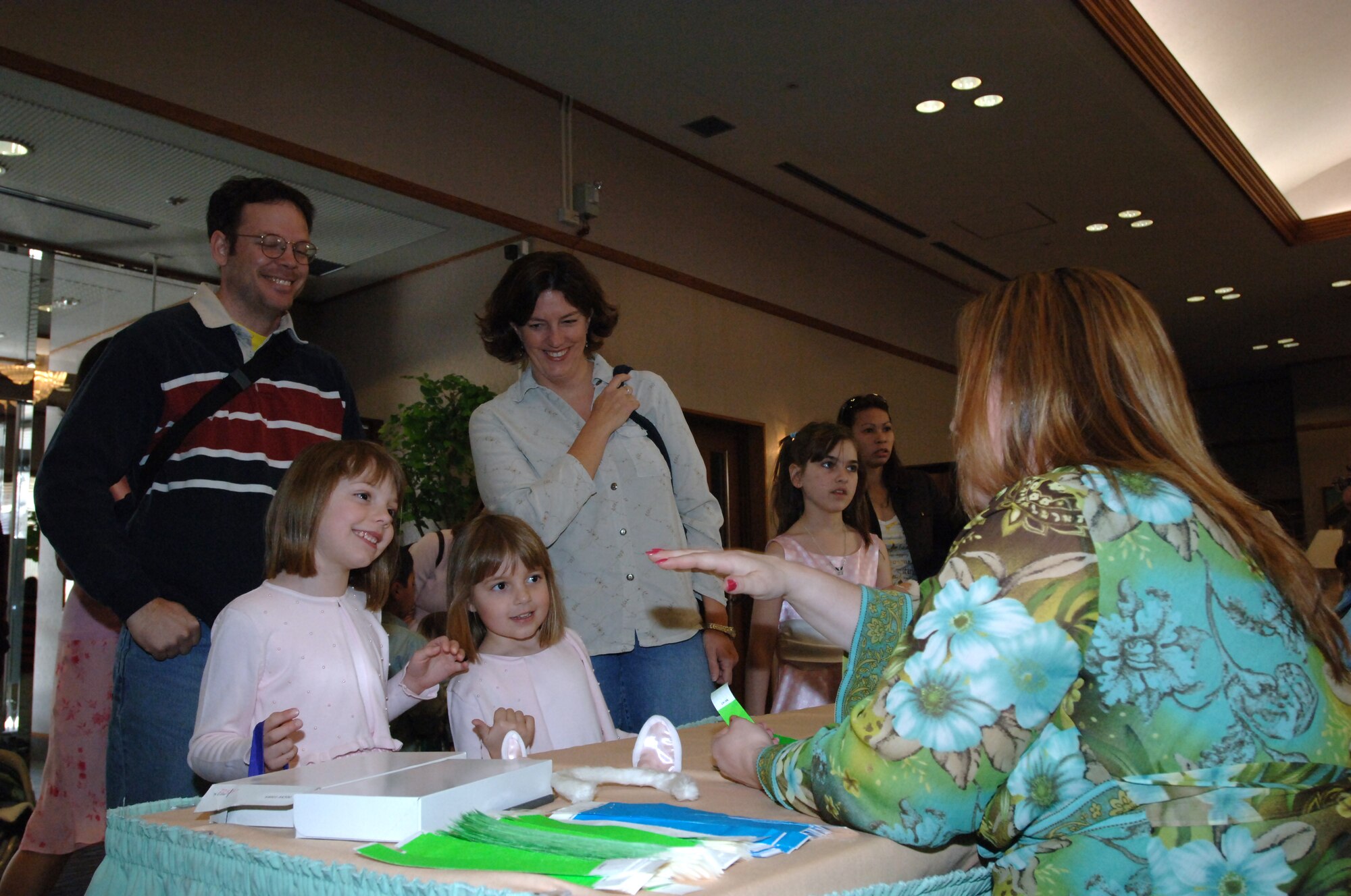 MISAWA AIR BASE, Japan -- Families sign-in to the Easter egg hunt, free for club members, at the officer's club March 23, 2008.  The event went from 1 to 3 p.m. and offered family portraits with the Easter bunny.  (U.S. Air Force photo by Senior Airman Robert Barnett)