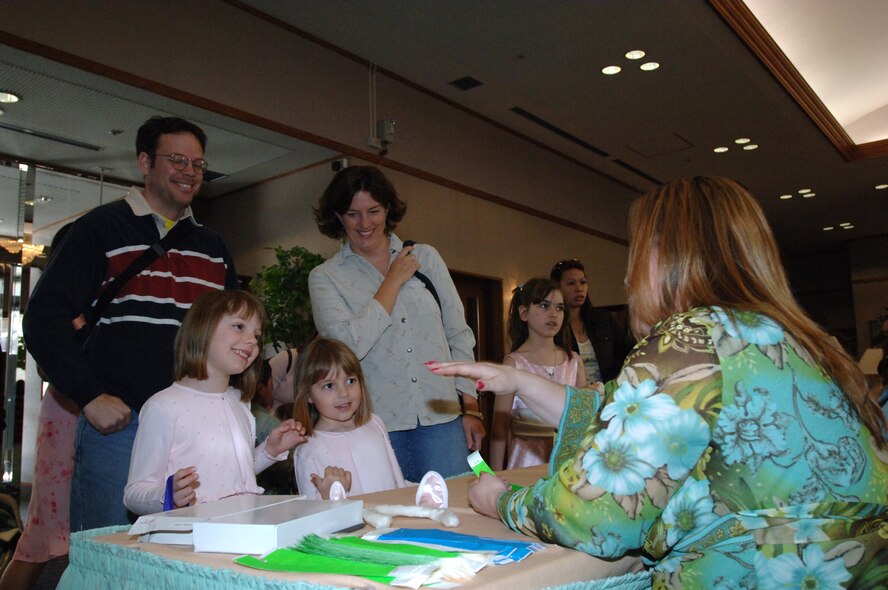 MISAWA AIR BASE, Japan -- Families sign-in to the Easter egg hunt, free for club members, at the officer's club March 23, 2008.  The event went from 1 to 3 p.m. and offered family portraits with the Easter bunny.  (U.S. Air Force photo by Senior Airman Robert Barnett)