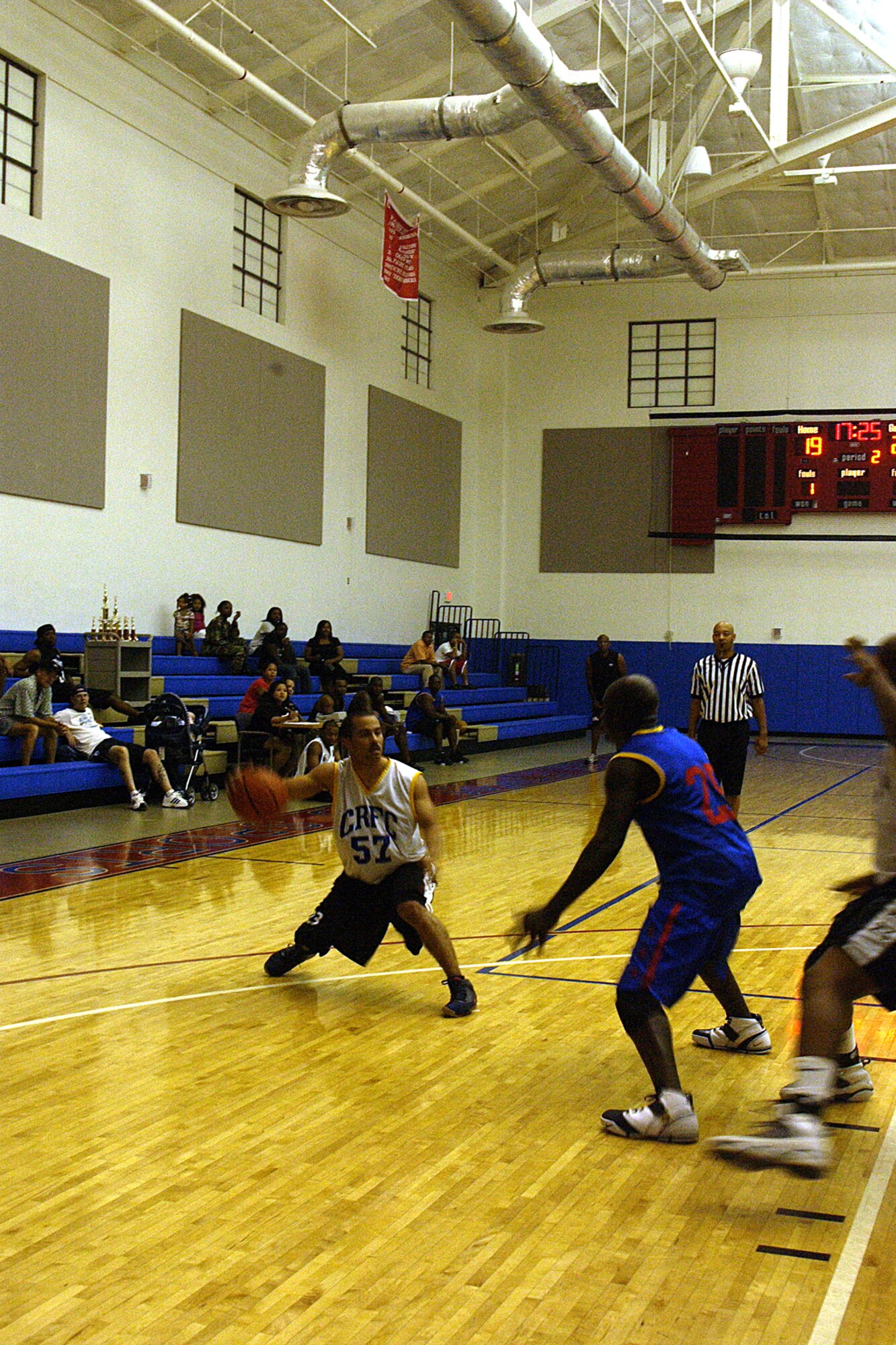 Staff Sergeant Gregory Moorer, 36th Communications Squadron fakes left hoping to get past Staff Sergeant Desmond Williams, 554 REDHORSE Squadron during the championship game of the intramural basketball league here at Andersen. The 36th Communications Squadron has won championships 3 years in a row. (U.S. Air Force photo by Airman 1st Class Carissa Wolff) 