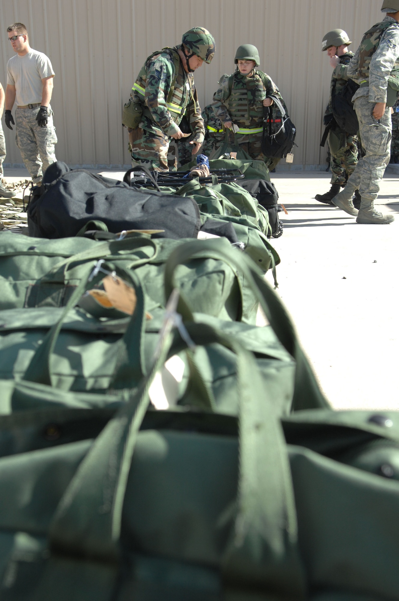 Airman from the 49th Material Maintenance Group drop off there mobility bags at the deployment processing center on March 26, 2008, during exercise Coronet Gold Rush 08-02, Holloman Air Force Base, N.M..
(U.S. Air Force photo/Senior Airman Anthony Nelson Jr)