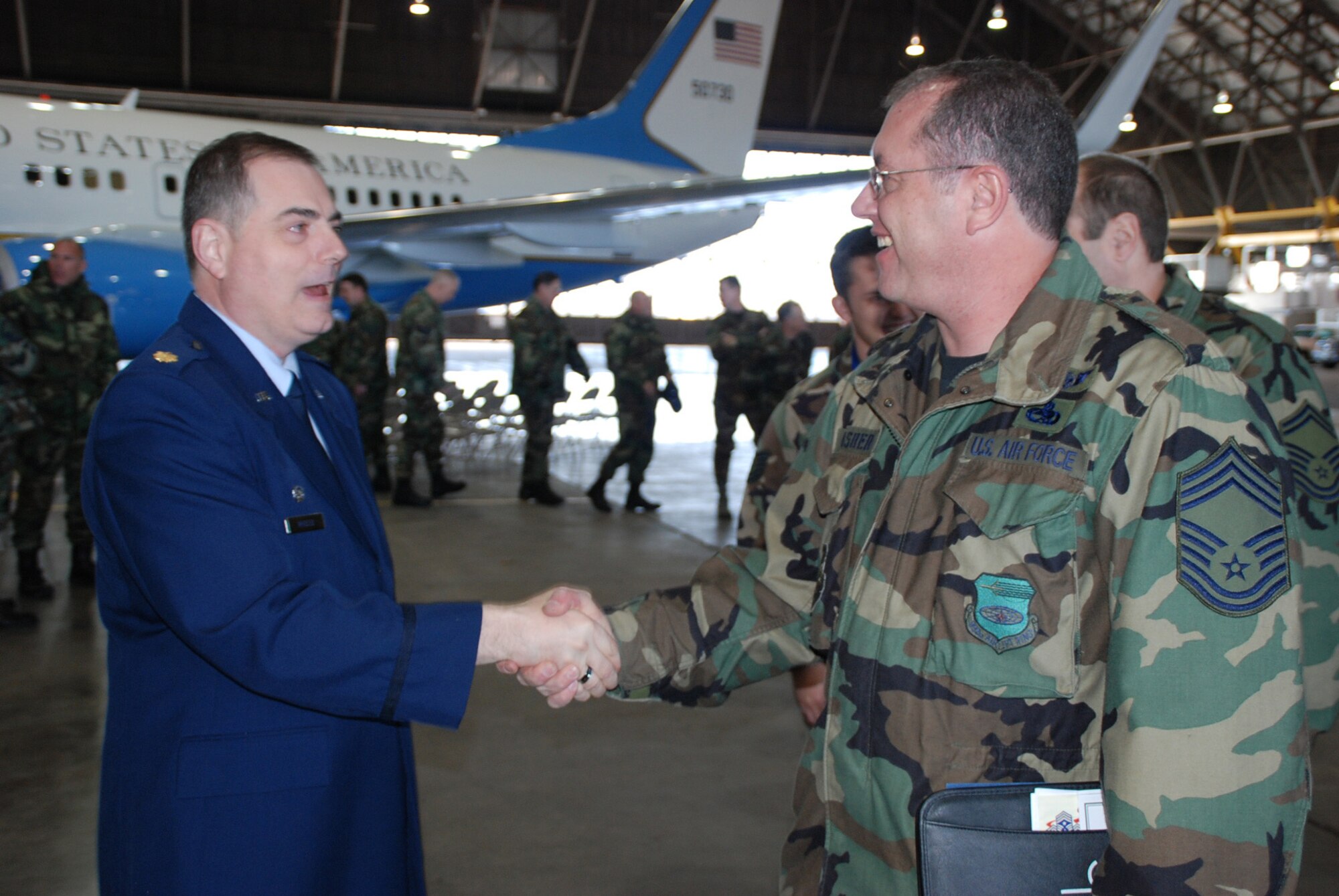 Maj. Clifford Waller, the 932nd Maintenance Squadron's new commander, greets one of the maintainers of aircraft at the 932nd Airlift Wing. Major Waller assumed command at the March unit training assembly and thanked reservists for their work. Photo/Tech. Sgt. Dan Oliver