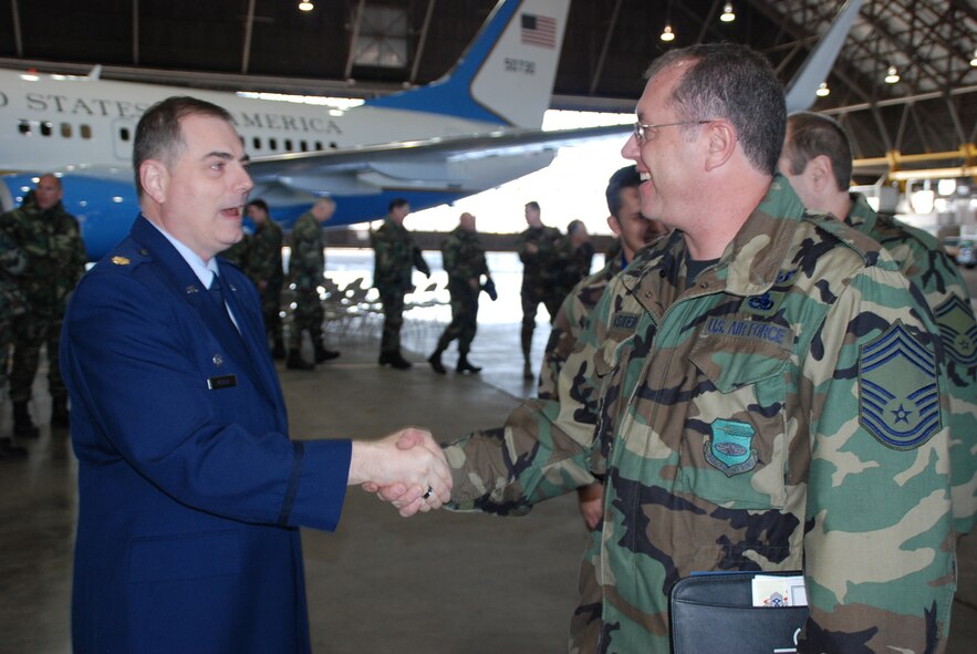 Maj. Clifford Waller, the 932nd Maintenance Squadron's new commander, greets one of the maintainers of aircraft at the 932nd Airlift Wing. Major Waller assumed command at the March unit training assembly and thanked reservists for their work. Photo/Tech. Sgt. Dan Oliver