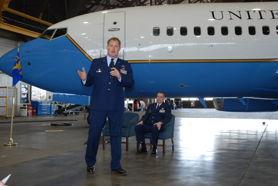 Lt. Col. Kirk Peddicord introduces Maj. Clifford Waller, to a crowd as the 932nd Maintenance Squadron's new commander, 932nd Airlift Wing. Major Waller assumed command at the March unit training assembly. Photo/Tech. Sgt. Dan Oliver