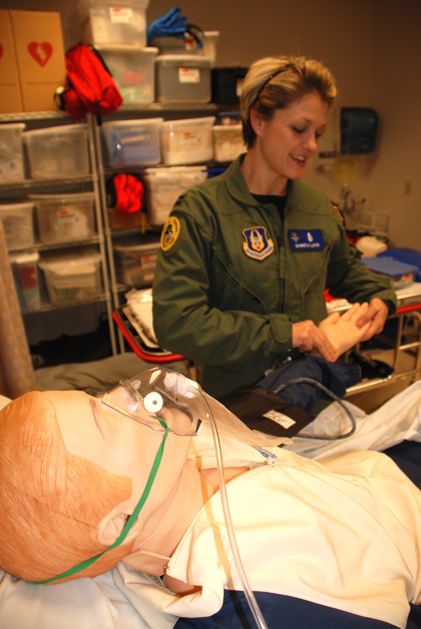 What's his pulse?  

Before heading overseas on an AEF deployment, 932nd Medical Group member Capt. Danielle Loyd gets an update on medical skills by checking the pulse of "SIM-MAN".  She worked on practicing lifesaving skills using the robotic patient, in the 932nd Medical Group building. She is a proud member of the 932nd Airlift Wing, part of the Air Force Reserve Command. Photo/Capt. Stan Paregien 