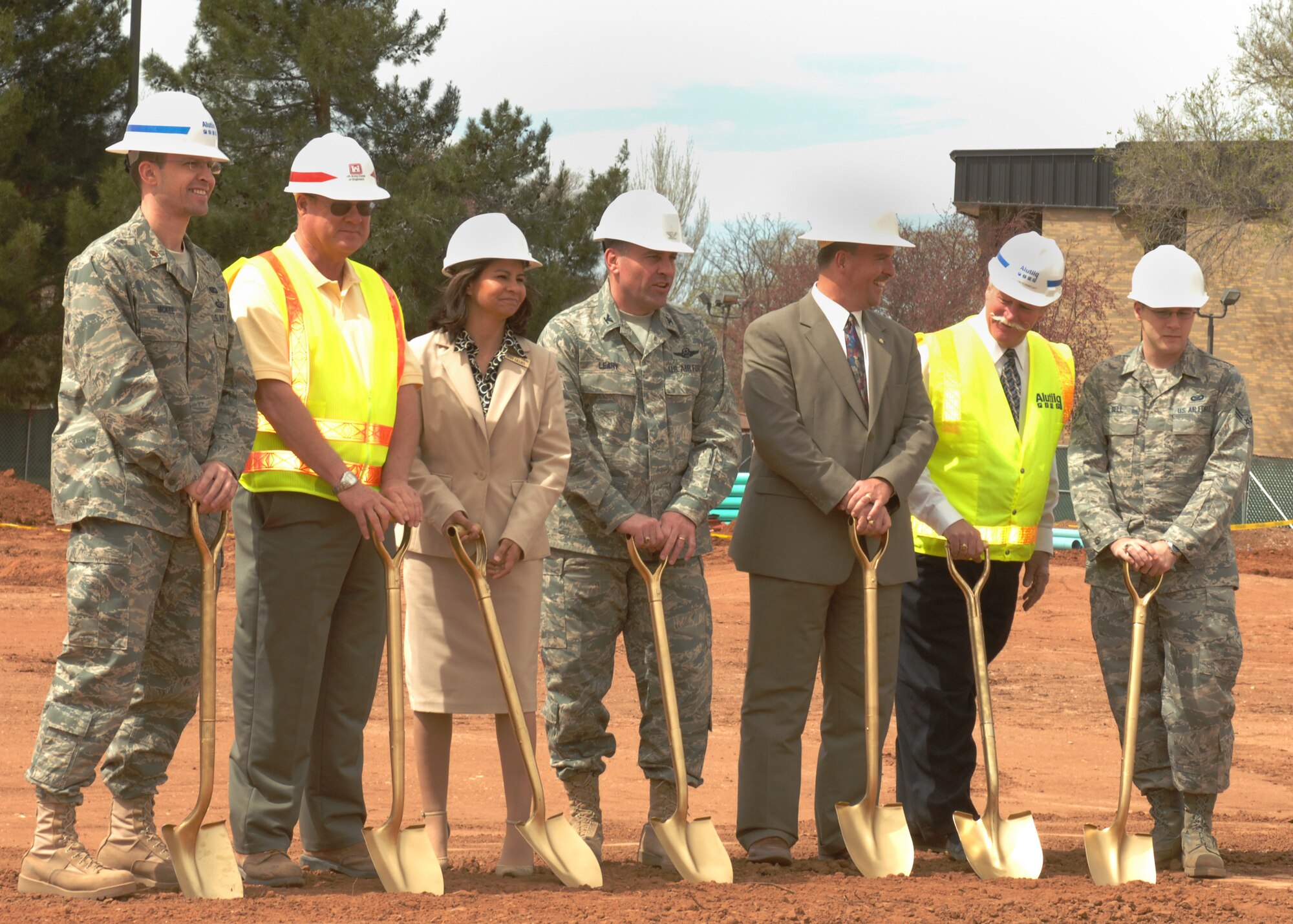CANNON AIR FORCE BASE, N.M. -- Left, Maj. Richard McKee, 27th Special Operations Services commander, center, Col. Timothy Leahy, 27th Special Operations Wing commander, right, Airman 1st Class James Bell, 27 SOW Public Affairs, Julie Gillies and Pete Evans, representatives for Sen. Pete Domenici, R-N.M. and contractors from Alutiiq Corp., break ground for a new $10 million Airmen's Center on March 26. The project is expected to be competed in June 2009. 