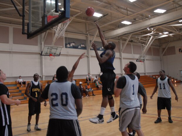 SVS player, Lamar Hancock, shoots and scores during his team's game versus APS Tuesday. (U.S. Air Force photo/Senior Airman Sam Hymas)