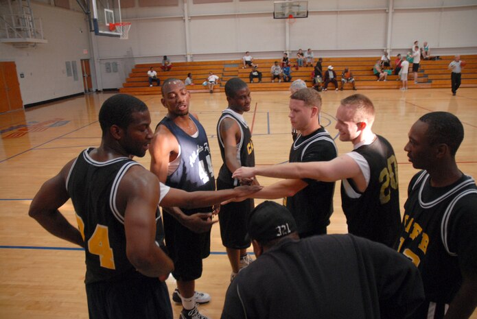 The 437th Services Squadron basketball team prepares for the second half of their intramural game versus the 437th Aerial Port Squadron Tuesday. (U.S. Air Force photo/Senior Airman Sam Hymas)