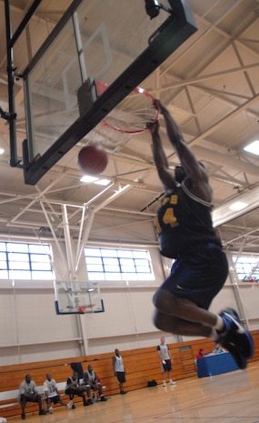 Clinton Coleman, 437th Services squadron, dunks the ball undefended during the SVS versus APS intramural basketball game Tuesday at the Fitness and Sports Center. (U.S. Air Force photo/Senior Airman Sam Hymas)