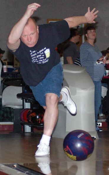 552nd AMXS bowler Rick Stutzman is focused as he throws a strike in game three of a match against the 72nd OSS March 19.  The 552nd AMXS won 3298-3020. ( Air Force photo by John E. Banks)